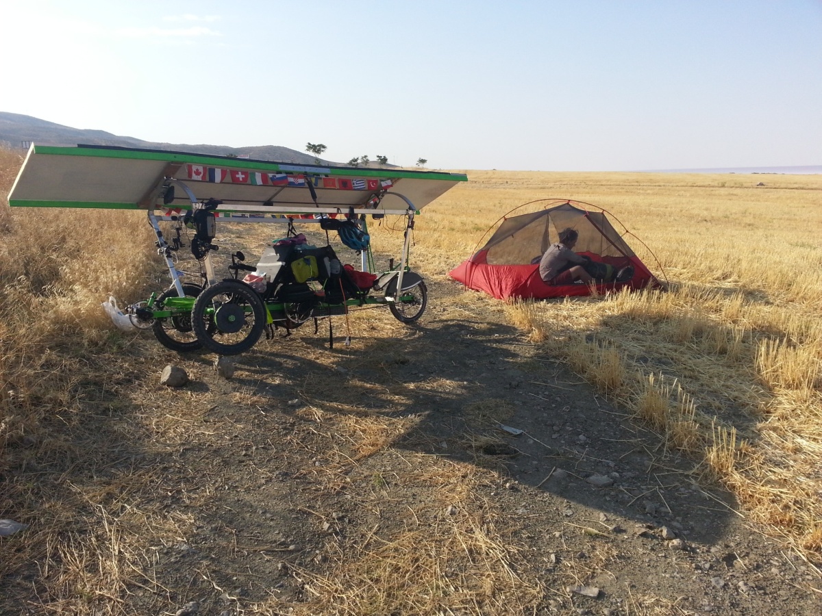 In the morning, we'd prope the trike wheels up on rocks to get a better angle for the sun.
More competitive teams would have already been on the road pedaling for 2 hours at this stage ;-)